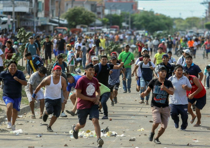 Supporters of Bolivian President Evo Morales and opposition candidate Carlos Mesa clash over disputed poll results in Santa Cruz