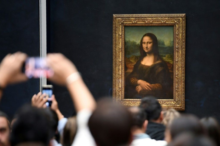 Organisers decided the Mona Lisa should remain in the Salle des Etats -- its normal home -- to help avoid overcrowding