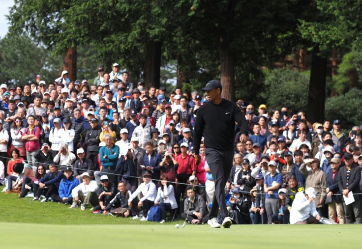 Prowling Tiger: Woods walks on the first green in front of packed galleries among a sellout 17,000-plus crowd at Narashino Country Club
