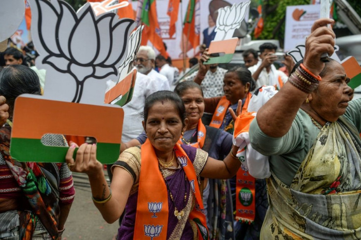 Scores of BJP workers turned up at the party's headquarters in Mumbai, with some carrying victory placards