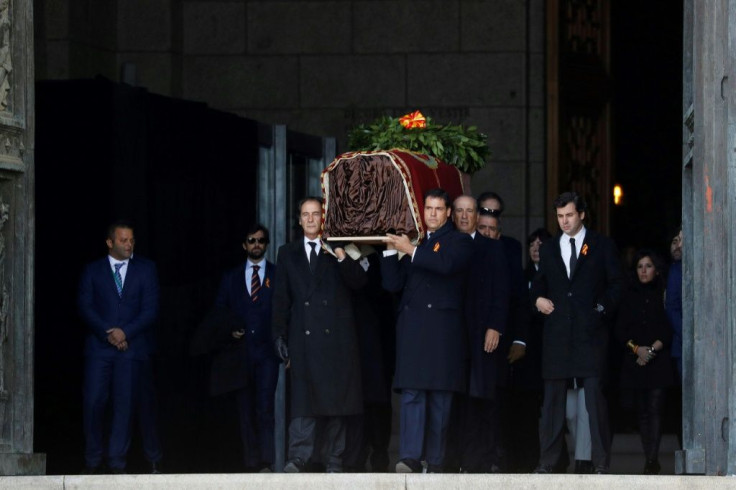 Wrapped in a cloth, Franco's dilapidated coffin was carried out of the basilica by eight family members