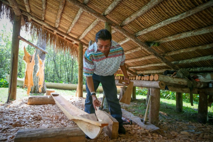 Daniel Tommie, of the Seminole tribe, carves a canoe at the Ah-Tah-Thi-Ki museum