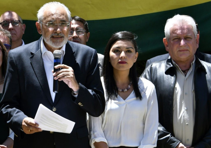 Bolivian presidential candidate for the Comunidad Ciudadana party, Carlos Mesa (L), delivers a press conference next to Santa Cruz Governor Ruben Costas (R) in La Paz on October 24, 2019