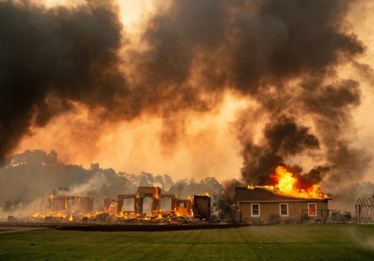 A building at a vineyard is engulfed in flames from the Kincade fire near Geyserville, California on October 24, 2019