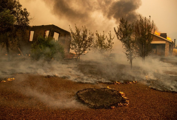 Structures burn at a vineyard during the Kincade fire near Geyserville, California on October 24, 2019