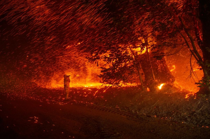 Mandatory evacuation orders were issued for the Californian community of Geyserville and nearby vineyards after a fire started in a mountainous area and quickly spread