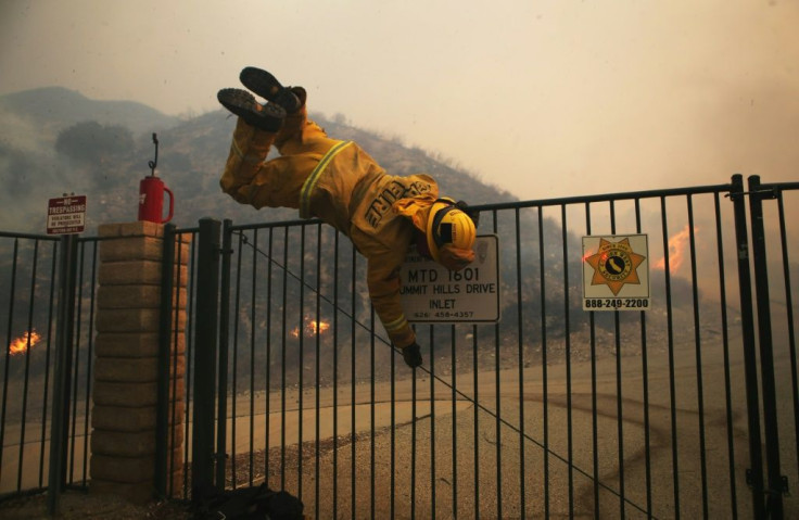 LA County firefighters battled through the night as the fast-moving Tick fire threatened some 10,000 structures