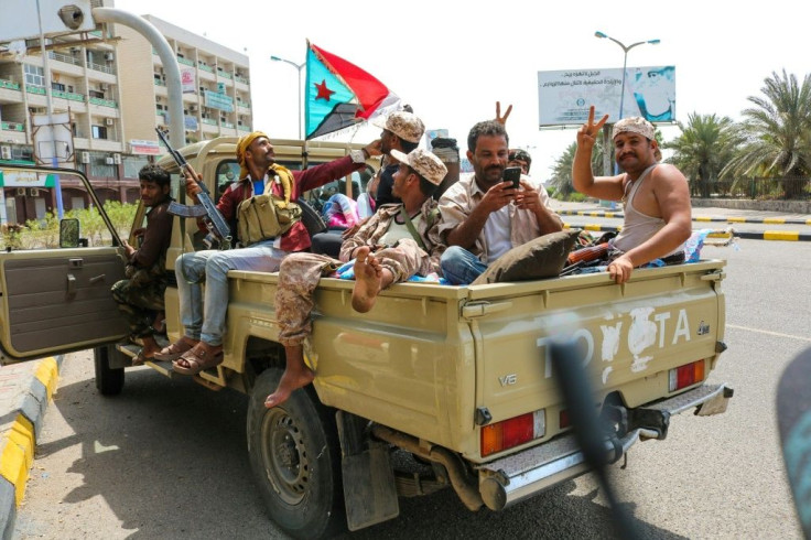 Fighters of the UAE-trained Security Belt Force, dominated by members of the Southern Transitional Council, fly a southern separatist flag, the old flag of South Yemen