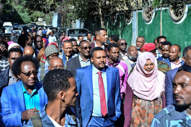 Jawar Mohammed, centre, among supporters who had gathered outside his home in Addis on Thursday. He has accused security forces of trying to orchestrate an attack against him