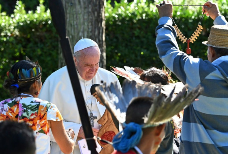 The Pope Francis receives gifts from representatives of indigenous Amazonian communities in the Vatican gardens on October 4. He apologised on Friday after indigenous statuettes were stolen from a church and thrown in the Tiber river