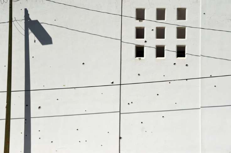 A wall riddled with bullet holes is seen after heavily armed gunmen waged an all-out battle against Mexican security forces in Culiacan
