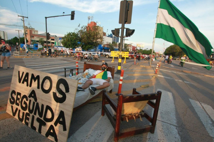 A supporter of Bolivian opposition candidate Carlos Mesa blocks an avenue in Santa Cruz, Bolivia, as a protest against election results confirming President Evo Morales as the winner