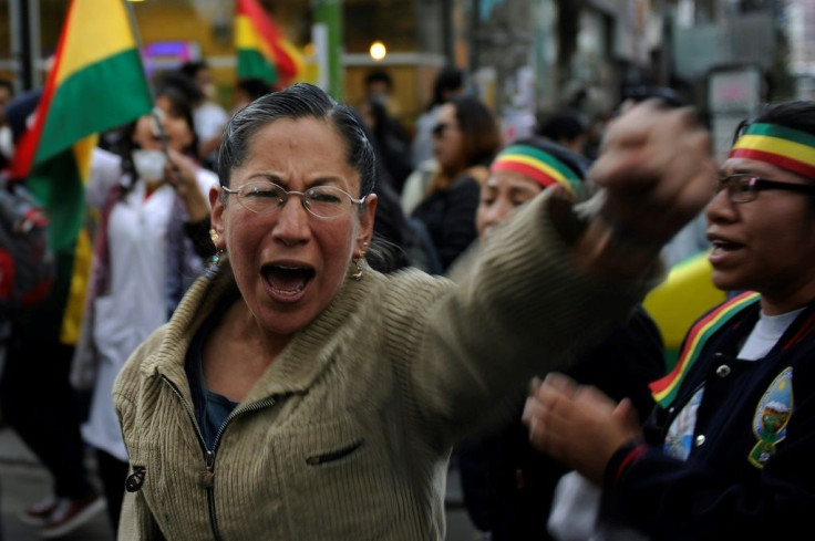 A woman shouts during a protest in La Paz against election results in Bolivia that will give Evo Morales a fourth presidential term; his challenger Carlos Mesa has denounced the count as a 'fraud'