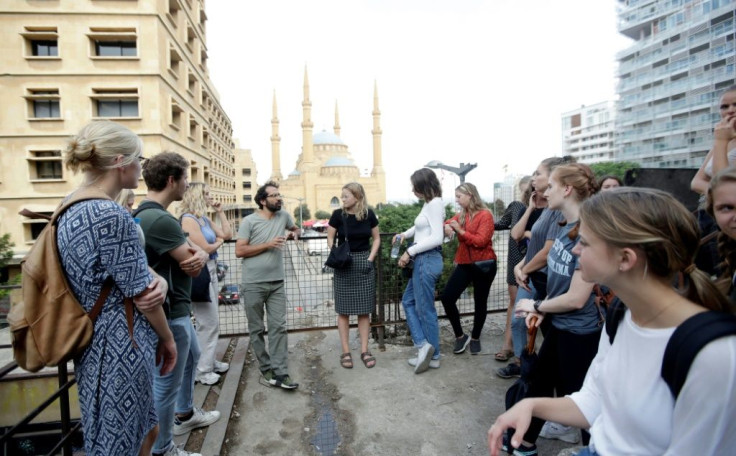 Jamil Mouawad (3rd-L), professor of political science at the American University of Beirut, gives an open-air lecture
