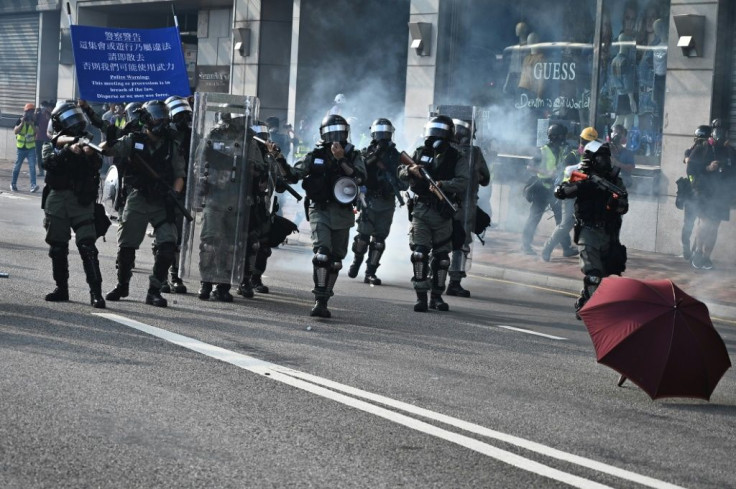 Police fire tear gas during a rally in Tsim Sha Tsui district which is usually packed with tourists and shoppers