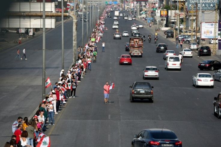 Lebanese protesters formed a 170-kilometre human chain from the southern port of Tyre to Tripoli in the north to underscore their unity against sectarian politics