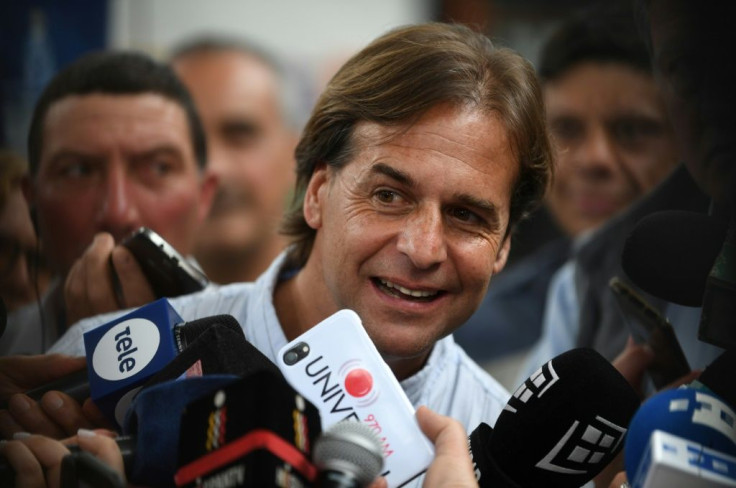 Uruguayan presidential candidate Luis Lacalle Pou, pictured speaking to reporters after voting, said he is already preparing for the second round