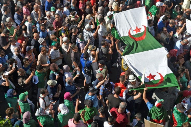 A new wave of demonstrations erupted over the last year in Algeria (pictured) Sudan, Iraq and Lebanon, typically demanding economic reforms and action against corruption