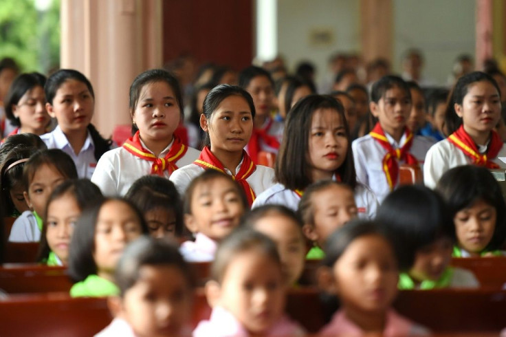 Local Vietnamese residents attend a mass in Phu Xuan village in Nghe An province for the 39 people found dead in a truck in Britain