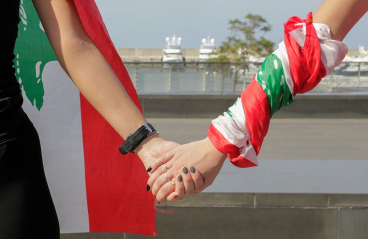 Tens of thousands of protesters joined hands to form a 170-kilometre (105-mile) human chain
