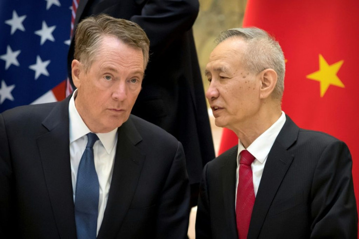 Wall Street was buoyed by hopes of a US-China trade deal: here, US Trade Representative Robert Lighthizer (L) and Chinese Vice Premier Liu He talk in Beijing