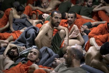 More than 12,000 Islamic State group prisoners are crammed into Kurdish-run detention centres like this one in northeastern Syria, with breakouts an ever-present risk amid a three-week-old Turkish offensive