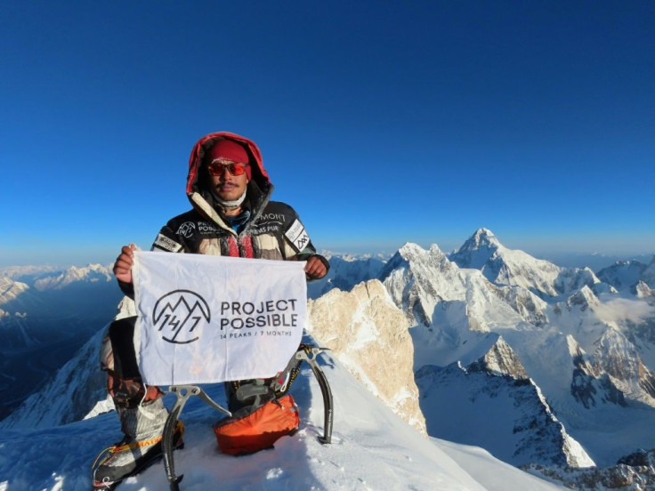 A picture released by Nirmal "Nims" Purja's Bremont Project Possible shows the climber on the summit of Gasherbrum II