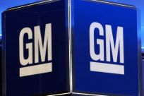 General Motors reported better-than-expected earnings on strong auto sales, but trimmed its full-year forecast due to the hit to the bottom line from the lengthy strike that ended last week