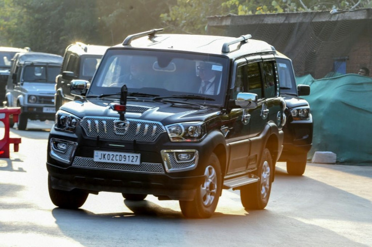 Members of a delegation of European Union parliamentarians drive to a hotel during a lockdown in Srinagar, the main city in Indian-administered Kashmir on October 29, 2019