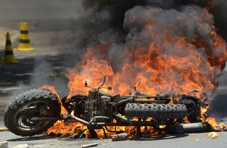 A motorbike burns in Cochabamba, a stronghold of Bolivia President Evo Morales, as clashes between his supporters and those of rival Carlos Mesa continue