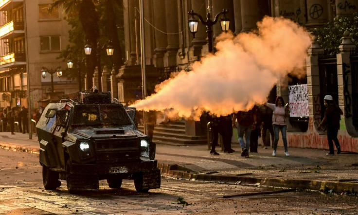 Riot police fire tear gas in Santiago, on October 29, 2019