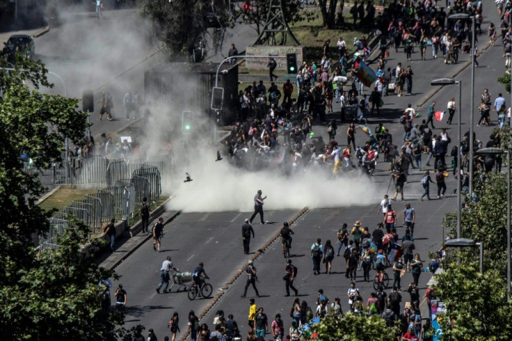 Demonstrators clash with security forces in Santiago, on October 30, 2019