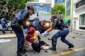 Police fired water guns and stun grenades to disperse the asylum-seekers staging a sit-in protest in the UN's Cape Town office
