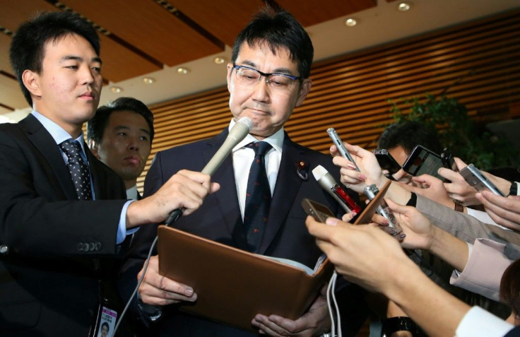 Japan's Justice Minister Katsuyuki Kawai speaks to journalists after submitting his resignation in Tokyo
