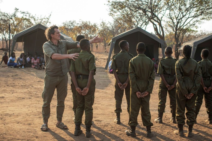 Australian Damien Mander (L) started the Akashinga programme in 2017 as part of the non-profit International Anti-Poaching Foundation that he founded