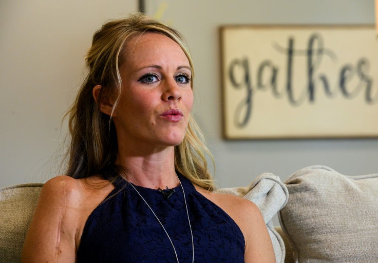 Kacey Ruegsegger Johnson, a survivor of the Columbine High school shooting in 1999, speaks with reporters from AFP in her house in Raleigh, North Carolina