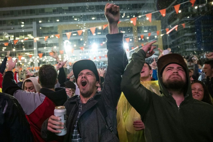 Fans react at The Bullpen bar near Nationals Park