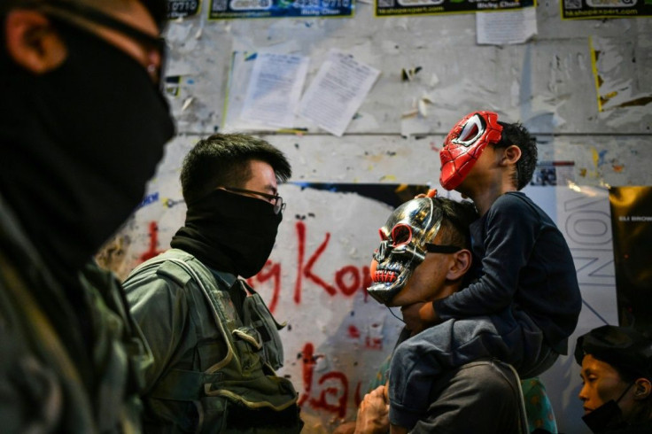 Policemen stopped some mask-wearing Halloween revellers from entering the Lan Kwai Fong entertainment area in Hong Kong