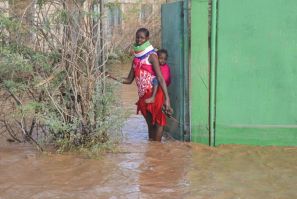 Some parts of northern Kenya received a year's worth of rain in a matter of weeks. A Turkana woman is shown here outside her home in the northwest
