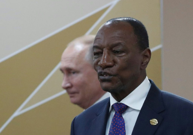 Tens of thousands of people have rallied in favor of Guinea's President Alpha Conde, pictured with Russian President Vladimir Putin October 24, 2019