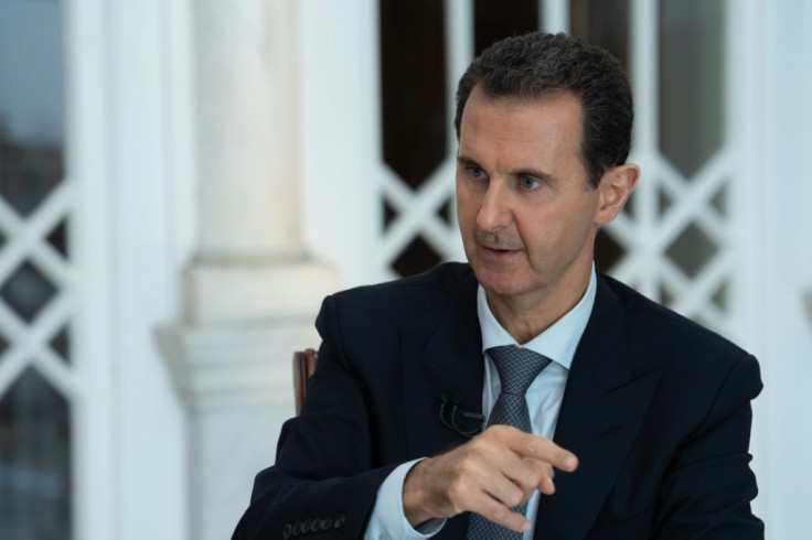 A handout picture released by the official Syrian Arab News Agency (SANA) on October 31, 2019 shows President Bashar al-Assad speaking during a special broadcast interview in Syria's capital Damascus