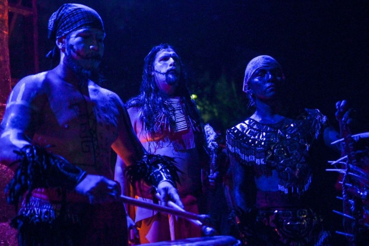 Actors perfom in front of the Day of the Dead altar in the Chapultepec Forest in Mexico City