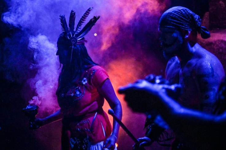 Actors perfom in front of the "Gran Ofrenda" (Mega Offering) installed in the Chapultepec Forest in Mexico City