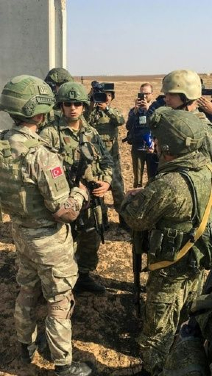 Turkish troops and Russian military police make final preparations for their joint patrol of the new 10 kilometre (six mile) deep buffer zone on the Syrian side of the border