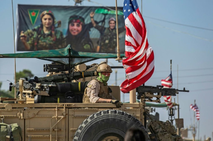 On Thursday, a US convoy added to the confusion of flags being flown by troops along the Syrian border, conducting a patrol of a section near the town of Qahtaniyah from which American forces had pulled back last month