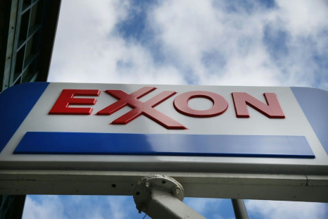 Exxon Mobil reported a sharp drop in third-quarter profits on lower oil prices, even as increased investment in US shale projects boosted output
