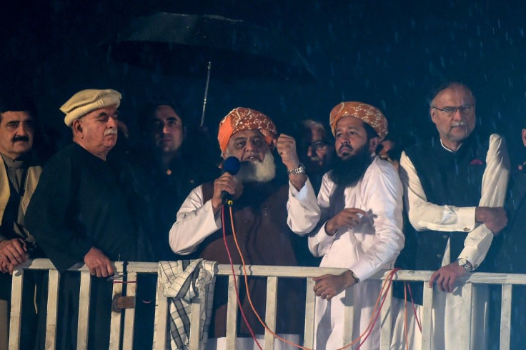 Islamic political party Jamiat Ulema-e-Islam (JUI-F) leader Maulana Fazlur Rehman (C) focused his ire on the country's powerful military