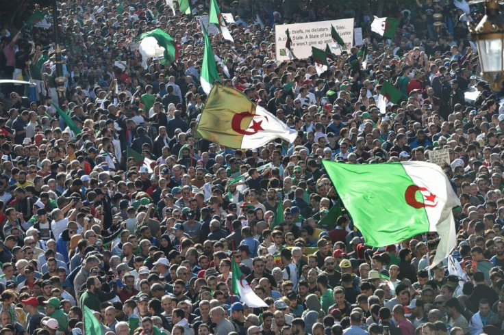 Anti-government protesters flooded the streets of Algiers on Friday in numbers resembling those of rallies at the peak of the movement that started in February