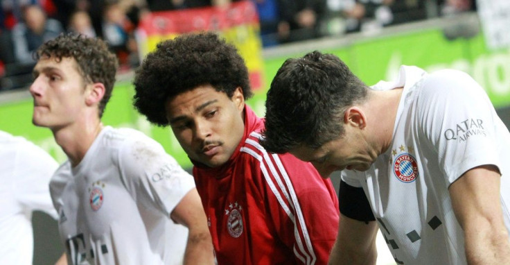 Bayern Munich defender Benjamin Pavard (L), winger Serge Gnabry (C) and Polish forward Robert Lewandowski (R) show their frustration after being thrashed 5-1 at Eintracht Frankfurt on Saturday.