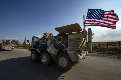 A convoy of US troops outside the Kurdish-majority city of Qamishli, in Syria's northeastern Hasakeh province on Saturday